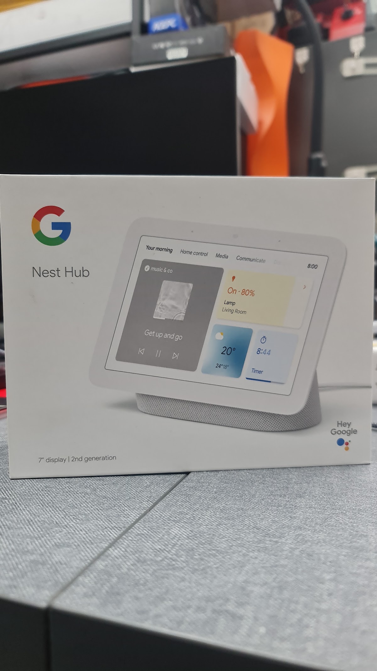 Google Nest Hub boxed at the shop counter
