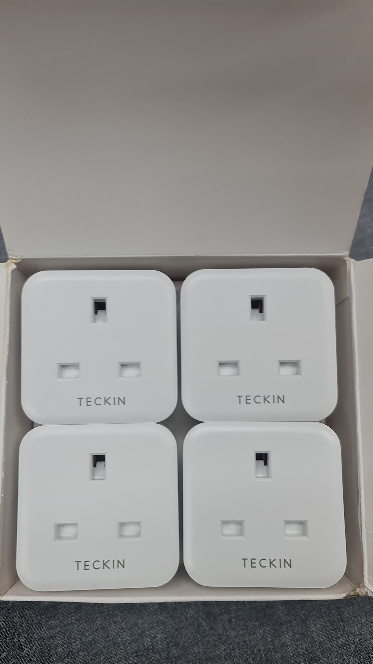 Box of four Teckin smart plugs