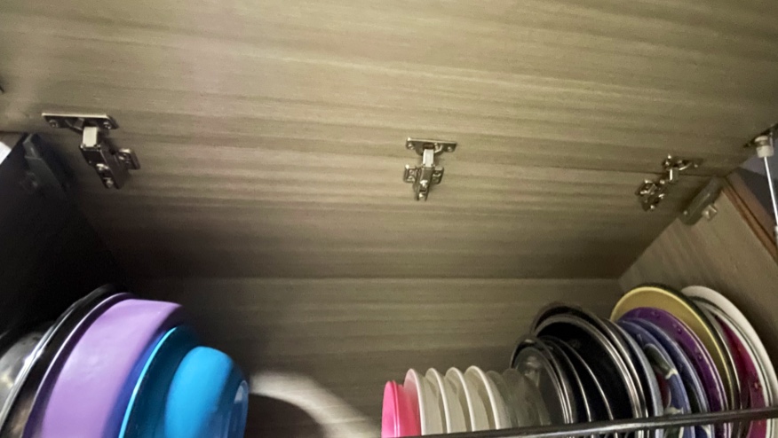 Kitchen top box lid with new soft close hinges above a plate rack